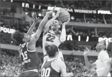  ?? AP/TONY GUTIERREZ ?? South Carolina forward A’ja Wilson (22) shoots over Mississipp­i State center Teaira McCowan (15) on Sunday during the second half of the NCAA women’s Final Four college basketball tournament final in Dallas.