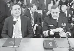  ??  ?? Comey (left) and Rogers take their seats at the House Intelligen­ce Committee hearing into alleged Russian meddling in the 2016 US election, on Capitol Hill in Washington, US. — Reuters photo