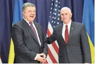  ?? GETTY IMAGES ?? Ukrainian President Petro Poroshenko (left) meets with U.S. Vice President Mike Pence at the Munich Security Conference.