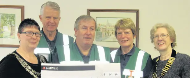  ??  ?? Shepshed Town Council has presented cheques, totalling almost £780, to Shepshed Food Bank and the Shepshed Lions Community First Responders. Pictured, left, is chairman of the council Coun Claire Poole presenting a cheque of £500 to Shepshed Lions Club...