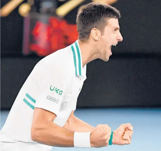  ?? WILLIAM WEST/GETTY-AFP ?? Top-ranked Novak Djokovic celebrates after beating Daniil Medvedev in straight sets to win his 18th Grand Slam title.