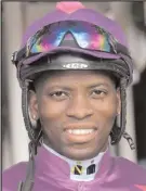  ??  ?? S’MANGA KHUMALO rode Carry On Alice to victory.