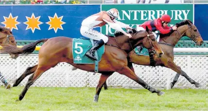  ?? Photo / Race Images ?? Amanood Lad (rails) defeats Chocolate Fish in yesterday’s Koral Steeplecha­se at Riccarton.