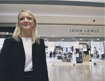  ??  ?? Operations manager Tracy Venner outside John Lewis Queensgate after its £21 million revamp last November.