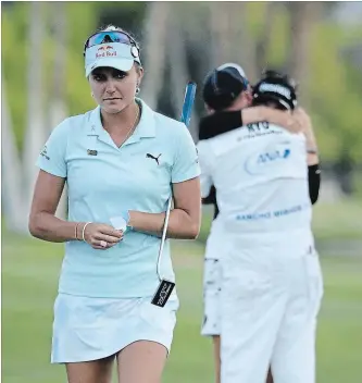  ?? JEFF GROSS GETTY IMAGES ?? One year ago: Lexi Thompson walks off the 18th green as So Yeon Ryu of the Republic of Korea celebrates with her caddie after Ryu defeated Thompson in a playoff during the final round of the ANA Inspiratio­n.