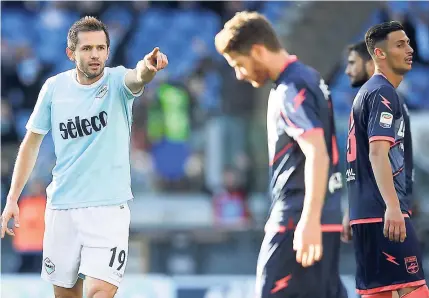  ??  ?? Lazio’s Senad Lulic (left) celebrates after he scored during an Italian Serie A match between Lazio and Crotone in Rome’s Olympic stadium, on Saturday.