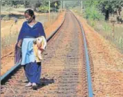  ?? HT PHOTO ?? Savitri Nag Yadav, employed as a ‘khalasi’ with the Indian Railways, makes sure that everything from fishplates to the tracks along which at least two dozen goods trains and a passenger train run every day are in order.