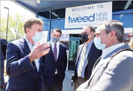  ?? Arnold Gold / Hearst Connecticu­t Media ?? From left, Gov. Ned Lamont; Avports CEO Jorge Roberts; John Picard, chairman of the Tweed New Haven Airport Authority; and Avports board member Jonathan Hunt speak after a May 6 news conference announcing major expansion plans at Tweed.