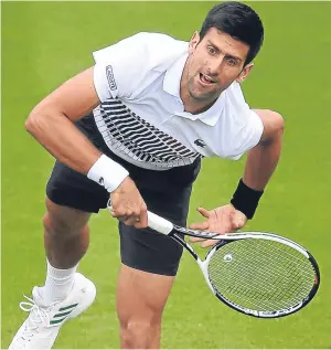  ?? Pictures: Getty/PA. ?? Novak Djokovic in action during his clash with Vasek Pospisil – then the rain intervened.