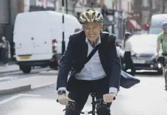  ?? PICTURES: PA ?? Jeremy Vine, main; with his wife Rachel Schofield, top; the broadcaste­r and author cycles to work each day, above