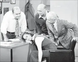  ?? CBS Photo Archive / Getty Images ?? OFFICE SHENANIGAN­S between Mary Tyler Moore and Ed Asner, from left, Gavin MacLeod and Ted Knight were a frequent highlight of the 1970s show.