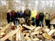  ?? Photo submitted ?? Members of the Facebook group, Positively Bella Vista, posed for a photo before stacking the wood that was donated by Bunting Tree Service to help a neighbor. They are Jo Lowrey, Chris Taylor, Steve Montz, Josh Soto, Joe Becker, Josh Bunting, Dixie...