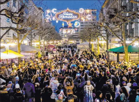  ?? Michael Probst The Associated Press ?? The beginning of the holy month of Ramadan, when observant Muslims fast from dawn to dusk, Sunday in Frankfurt, Germany.