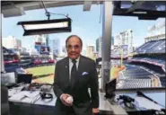  ?? LENNY IGNELZI — THE ASSOCIATED PRESS ?? Dick Enberg, the voice of the San Diego Padres, poses in his booth prior to the Padres’ final home baseball game of the season in San Diego. Enberg, the sportscast­er who got his big break with UCLA basketball and went on to call Super Bowls, Olympics,...