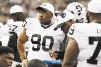  ?? Stephen Brashear / Associated Press ?? Raiders defensive tackle Dan Williams (90), who was signed as a free agent after playing five years with the Cardinals, says, “I am fine with doing the dirty work.”