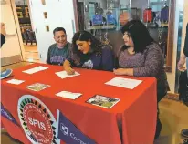  ?? JAMES BARRON/THE NEW MEXICAN ?? Santa Fe Indian School senior Jordan Moya, center, flanked by parents Anthony and Eunice Moya, signs Monday a letter of intent to compete for Cornell College’s track and field team. Moya will compete in the shot put and the discus for the NCAA Division...