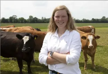  ??  ?? Ailish with some of the family’s suckler herd