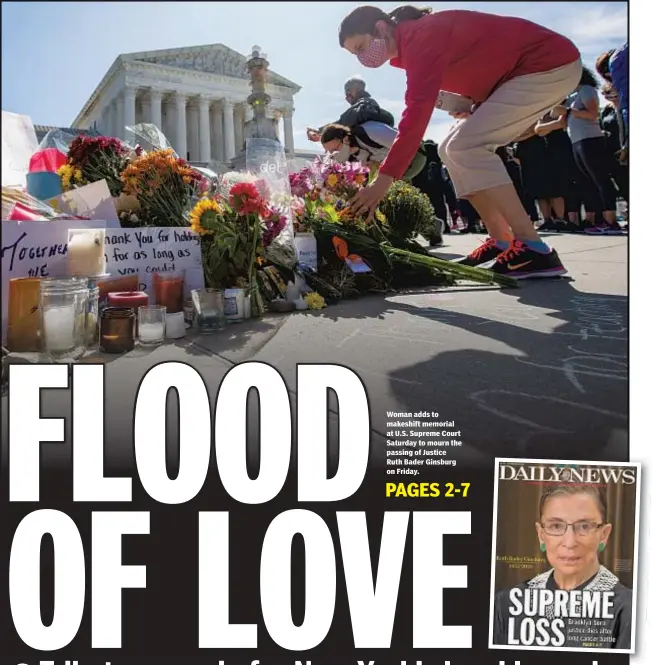  ??  ?? Woman adds to makeshift memorial at U.S. Supreme Court Saturday to mourn the passing of Justice Ruth Bader Ginsburg on Friday.
