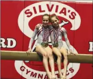  ?? SUBMITTED PHOTO ?? Silvia’s Gymnastics Level 4 members Alisha Linthicum and Isabella DuCharme pose with their medals at the PA State Championsh­ip meet held at Bald Eagle High School.