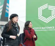  ?? — Reuters ?? Delegates arrive for the COP24 UN Climate Conference in Katowice.