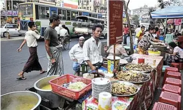  ??  ?? A typical Burmese meal includes steamed rice, fish, meat, vegetables and soup. Locals use their fingertips to mould rice into a small ball and then mix it with various dishes. – CNN