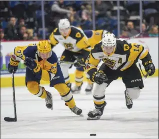  ?? GARY YOKOYAMA, THE HAMILTON SPECTATOR ?? Hamilton Bulldog Will Bitten, right, races Erie’s Maxim Golod for the puck heading toward the Otter net in 7-4 win.