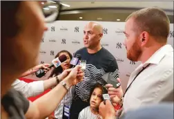  ?? Getty Images/tns ?? Carlos Beltran participat­es in an interview with media members after a game with the New York Yankees in 2016.