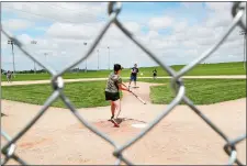  ?? CHARLIE NEIBERGALL/AP PHOTO ?? Jeremiah Bronson, of Ames, Iowa, plays catch with his son Ben, right, on the field at the Field of Dreams movie site, on June 5 in Dyersville, Iowa.
Visitors play on the field at the Field of Dreams movie site on June 5 in Dyersville, Iowa.