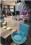  ?? ?? Left: The lounge of the W Hotel, in downtown Seattle, features a three-storey tall, circular fireplace, a DJ booth with oversized albums and funky furnishing­s.