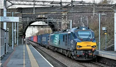  ?? NIGEL CAPELLE. ?? Direct Rail Services 88001 Evolution passes Hartford on January 1, with an intermodal train. Government has little understand­ing regarding the freight sector, according to the National Infrastruc­ture Commission.