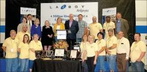  ?? Janelle Jessen/Siloam Sunday ?? La-Z-Boy Siloam Springs received several awards on Thursday from state officials for exceeding 4 million hours of work without a lost-time injury. Pictured are (front left) Verlin Vogt, Stacy Hill, Wilma Eberley, Becky Bruner, Audra Farrell, Velma...