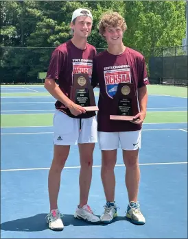  ?? PHOTO SPECIAL TO THE O-N-E ?? Hickory High brothers Clint (left) and Graham Powers (right) holding their NCHSAA 3A Doubles Draw State Championsh­ip trophies on Saturday.