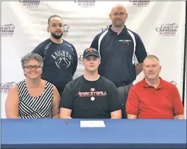  ?? SUBMITTED PHOTO ?? Grace Christian Academy graduate Nate Owens recently committed to Frostburg State University for men’s basketball. Owens will be studying mechanical engineerin­g. Standing, from left, are Grace Christian assistant boys basketball coach Jordan Williams...