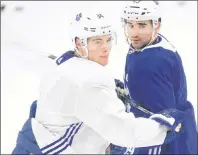  ?? CP PHOTO ?? Toronto Maple Leafs centres Auston Matthews, left, and Nazem Kadri take part in a drill during Monday’s practice in Toronto.