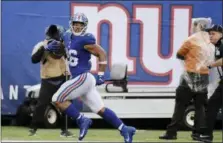  ?? BILL KOSTROUN — ASSOCIATED PRESS ?? Giants running back Saquon Barkley runs for a touchdown in the fourth quarter of Sunday’s game against the Jaguars in East Rutherford, N.J.