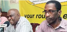  ?? FILE ?? JUTC’s Managing Director Colin Campbell (left) addresses the media at a press conference while Radcliffe Lewis looks on.