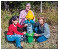  ?? PHOTOS BY WILLIAM HARVEY/THREE RIVERS EDITION ?? Pamma Henderson, left, and Lisa Duggan, right, paint fire hydrants in Fairfield Bay as a way to help support the Fairfield Bay Animal Protection League. Fairfield Bay Mayor Paul Wellenberg­er adopted this fire hydrant and had it painted in honor of Fat...