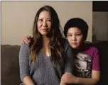  ??  ?? NANCY CHEN and her son Chance Davis, 12, at home in Pasadena. When Chen recovered her mother’s purse, inside she found sacred bracelets and writings, as well as bread rolls.