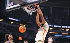  ?? TENNESSEE ATHLETICS PHOTO ?? Tennessee sophomore forward Jonas Aidoo finishes off a dunk during Saturday’s 65-52 win over Duke in Orlando.
