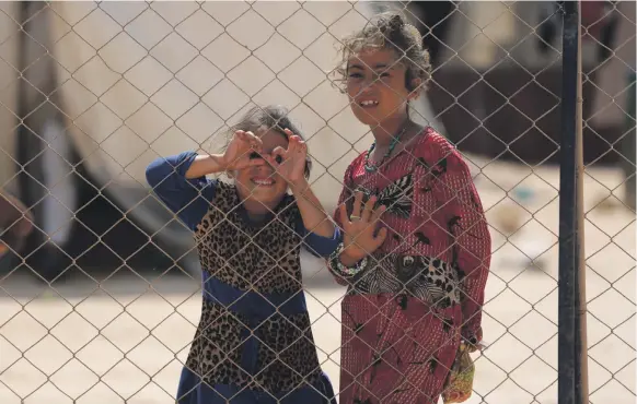  ??  ?? Children at a camp in Kafr Lusin in Idlib province near the border with Turkey after fleeing regime and Russian air strikes that pounded areas farther south