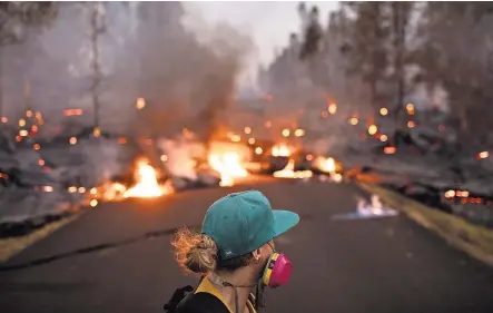  ?? TAMIR KALIFA FOR THE NEW YORK TIMES ?? As Kilauea erupted in Hawaii, many wondered why thousands put down stakes in a disaster-prone area.