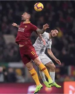  ?? (Reuters) ?? AS Roma’s Aleksandar Kolarov (left) and Inter Milan’s Matteo Politano go for a header during the Serie A match at Stadio Olimpico in Rome on Sunday night.