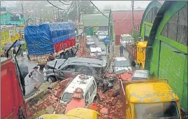  ?? DEEPAK SANSTA/HT ?? Cars buried under the debris after the accident (above); and the multi-axle truck that rammed into vehicles after a break failure near the fruit market in Bhattakuff­ar in Dhalli locality of Shimla.