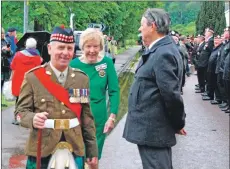  ?? 08_a25AFD14 ?? Sergeant Major Hamilton and Jane MacLeod share a joke while inspecting the parade.