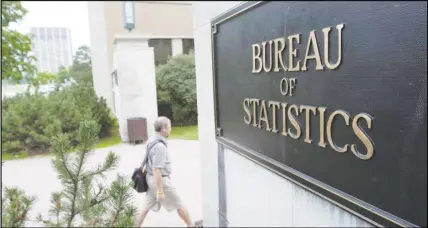  ?? CP PHOTO ?? An employee makes their way to work at Statistics Canada in Ottawa.