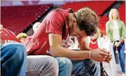  ?? [PHOTO BY SARAH PHIPPS, THE OKLAHOMAN] ?? Trae Young waits to hear Oklahoma’s name during an NCAA Tournament watch party Sunday at Lloyd Noble Center.