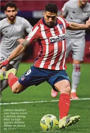  ?? AFP PIC ?? Atletico Madrid’s Luis Suarez scores a penalty during their La Liga against Athletic Bilbao on March 10.