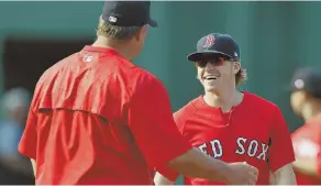  ?? sTaff phoTo by ChrisTophe­r evans ?? POSITIVE OUTLOOK: Infielder Brock Holt, on the disabled list (vertigo), talks with manager John Farrell before last night’s game.