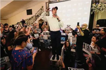  ?? Eric Gay / Associated Press ?? Texas Democratic gubernator­ial candidate Beto O’Rourke meets with supporters after his debate Friday night with incumbent GOP Gov. Greg Abbott in Edinburg. Polls show a single-digit race.