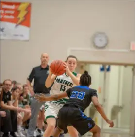  ?? AIMEE BIELOZER — FOR THE MORNING JOURNAL ?? Elyria Catholic’s Regan Schill looks to pass down court to a teammate on March 2.